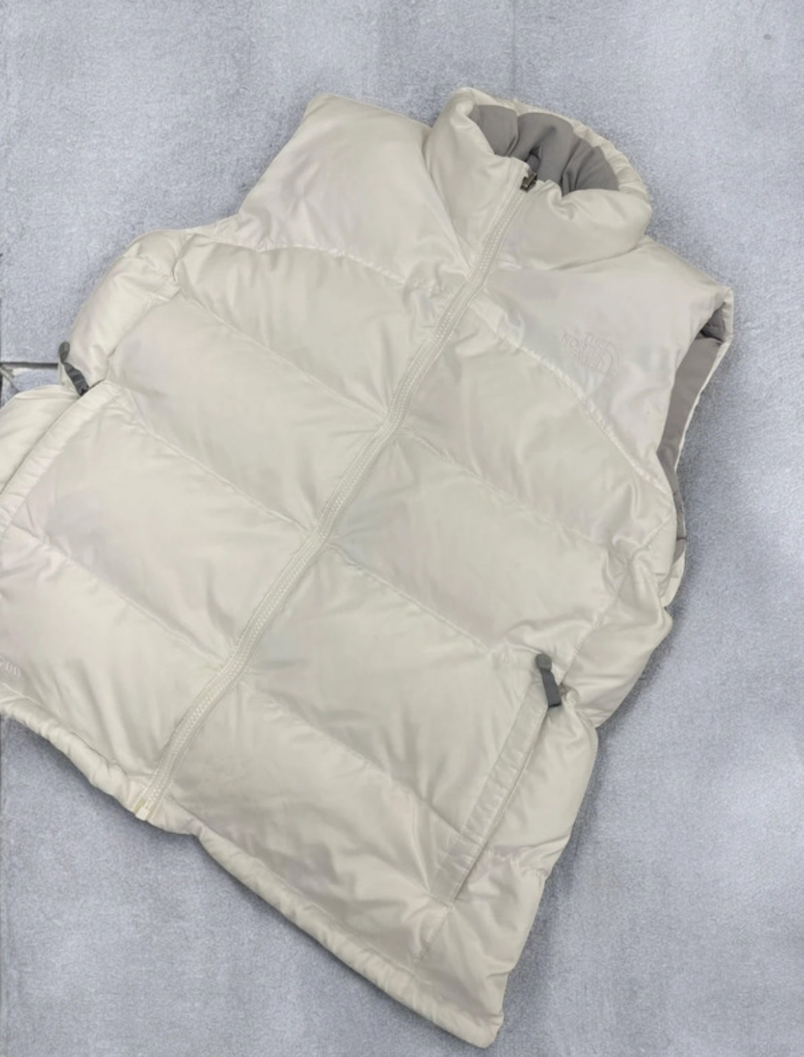 All white The North Face Gilet (L)