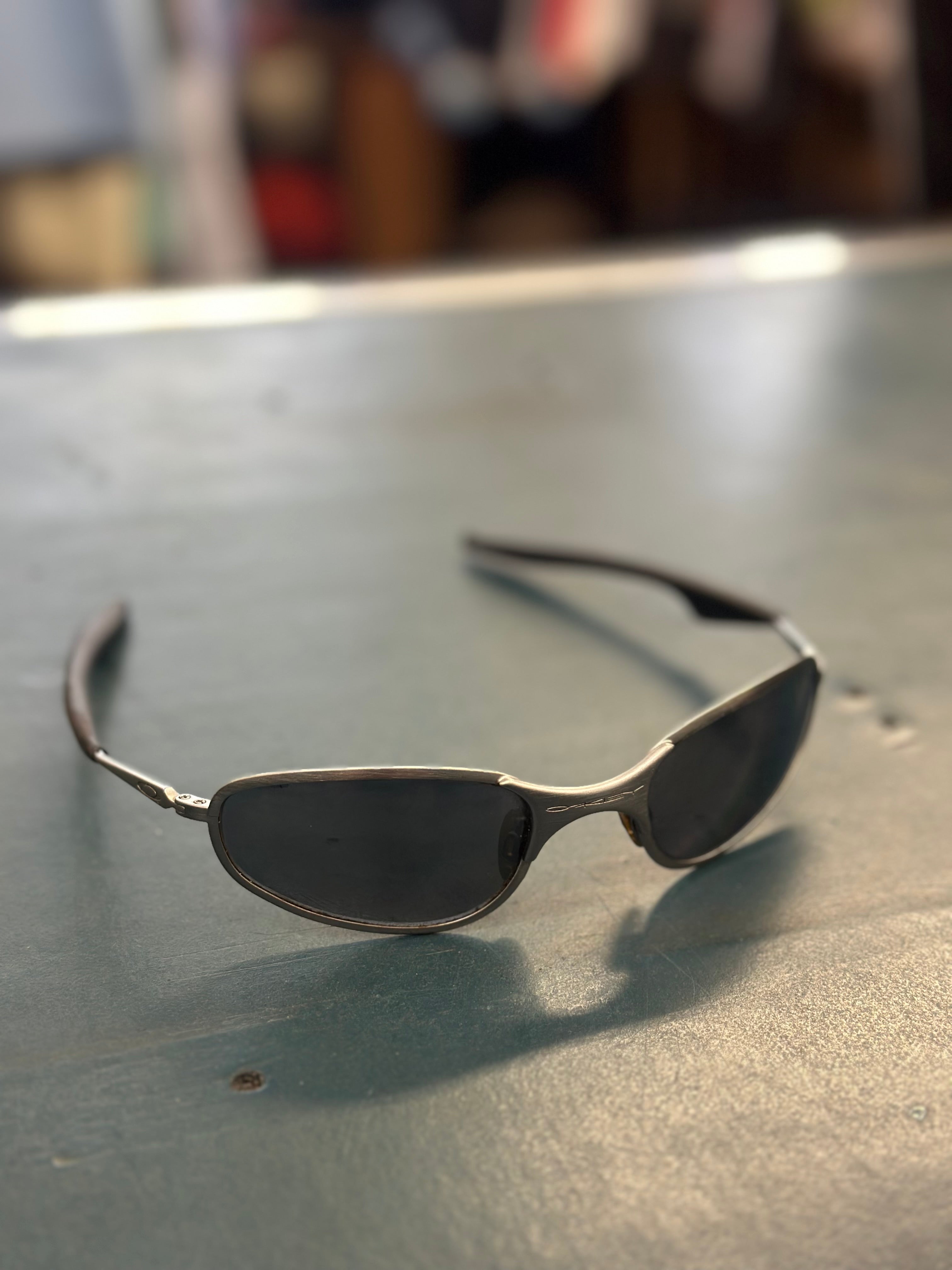 Oakley A Wire Brushed Silver Sunglasses – PALM STUDIOS VINTAGE Oakley A Wire Brushed Silver Sunglasses – PALM STUDIOS VINTAGE